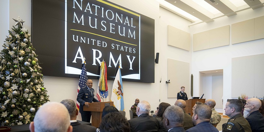 An image of the National Museum of the United States Army event featuring festive decor and speakers.