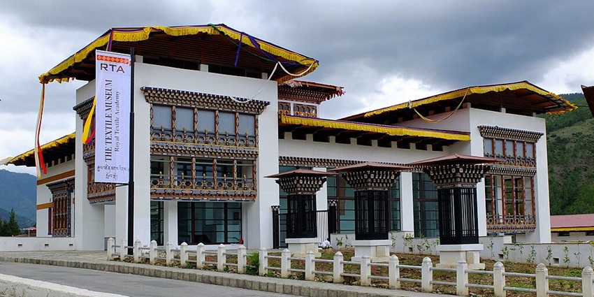 A view of the entrance area of the National Textile Museum near the clock tower square