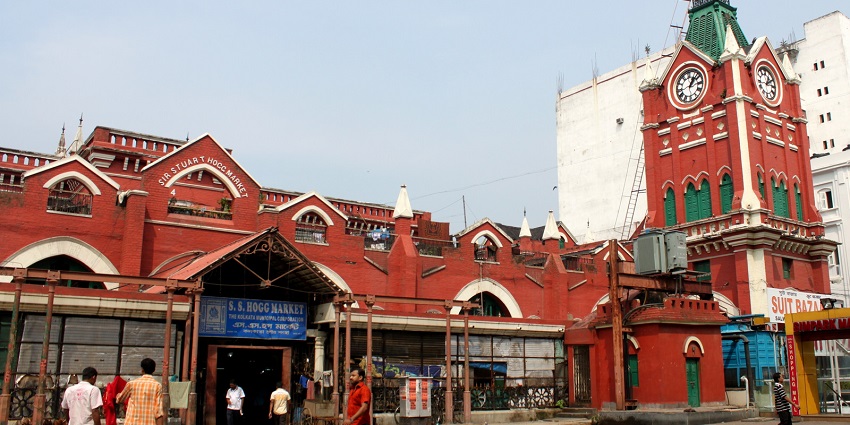 A heritage shopping complex in Kolkata, bustling with shoppers.