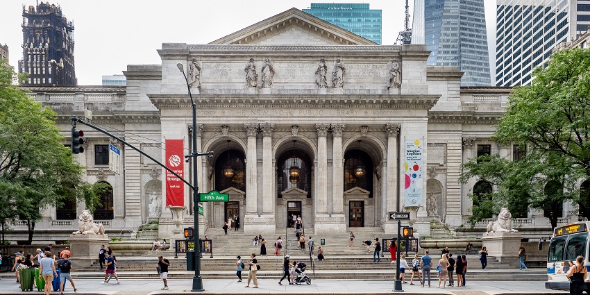 The New York Public Library's grand facade with columns, statues, and iconic sculptures.
