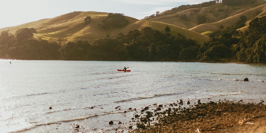 The stunning panorama of Abel Tasman National Park in New Zealand, ideal for sea kayaking.