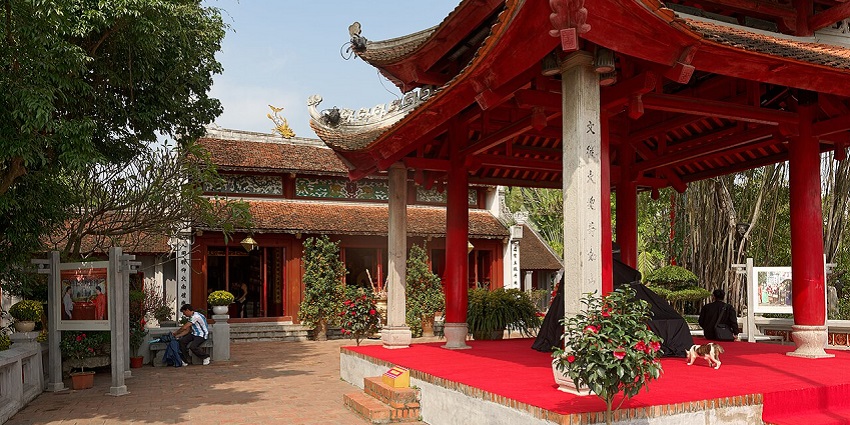 A mesmerizing view of Ngoc Son Temple, connected by the iconic red bridge