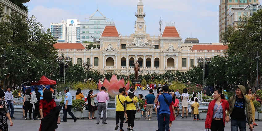 An image showing Nguyen Hue Street, one of the places to visit in Ho Chi Minh with people enjoying.