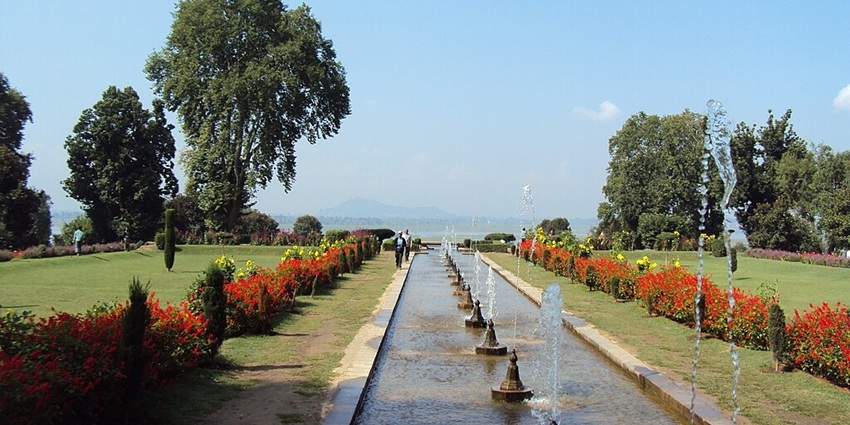 Nishat Bagh Mughal Gardens with a small water stream and multiple water fountains