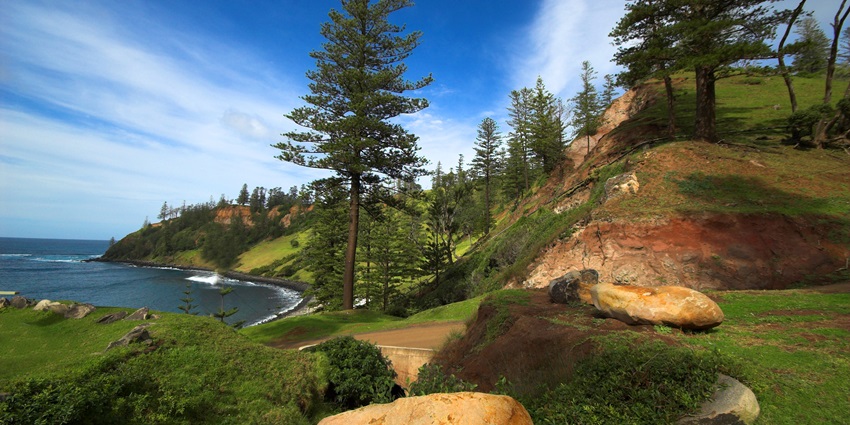 Norfolk Island, a peaceful retreat with beaches, cliffs, forests, and rich history.