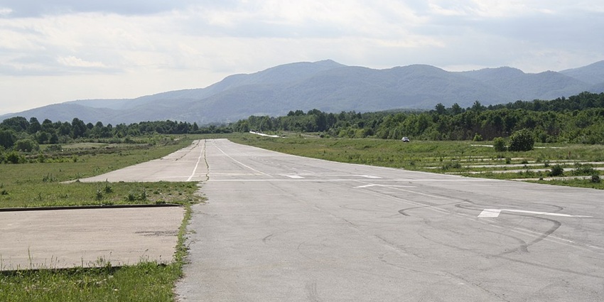 A smooth runway with a serene background is ideal for landing and taking off.