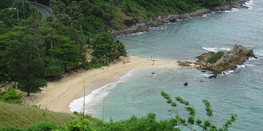 Nui Beach is a secluded Phuket beach with clear waters, cliffs, and peaceful surroundings.