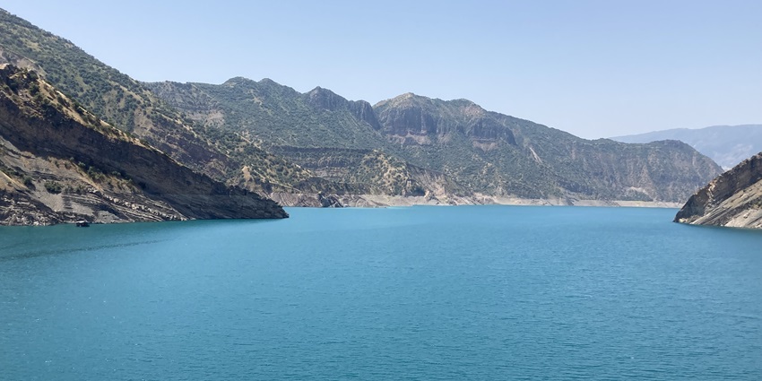 An image of Nurek Reservoir with blue waters among the Largest Artificial Lakes in Asia