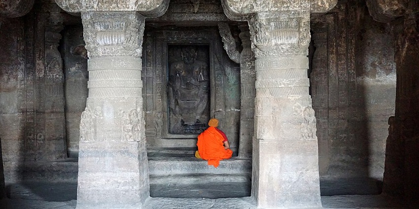 An image of an intricately carved stone cave for meditation, resembling the meditation caves in the Nyelung Dechenling