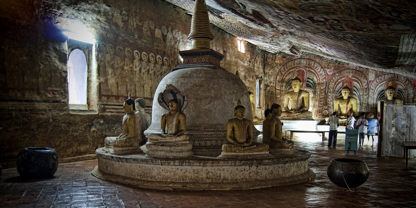 View of Buddha statues in the interior of the Dambulla Cave Temple in Sri Lanka.