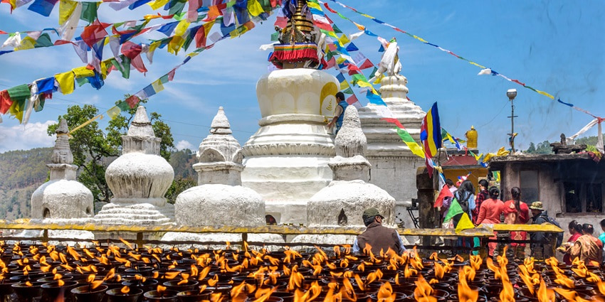 A serene glimpse of thousands of diyas being lit at the iconic Buddha Stupa Nepal.