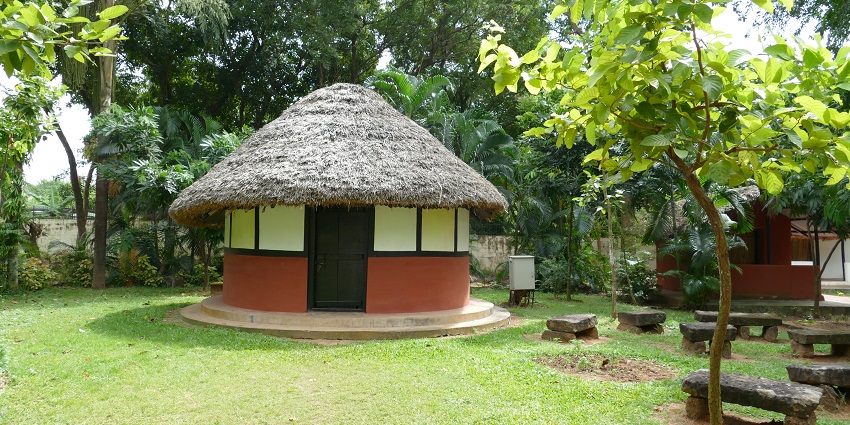 An image of a tribal hut in the Odisha State Tribal Museum, a famous Indian tribal museum.