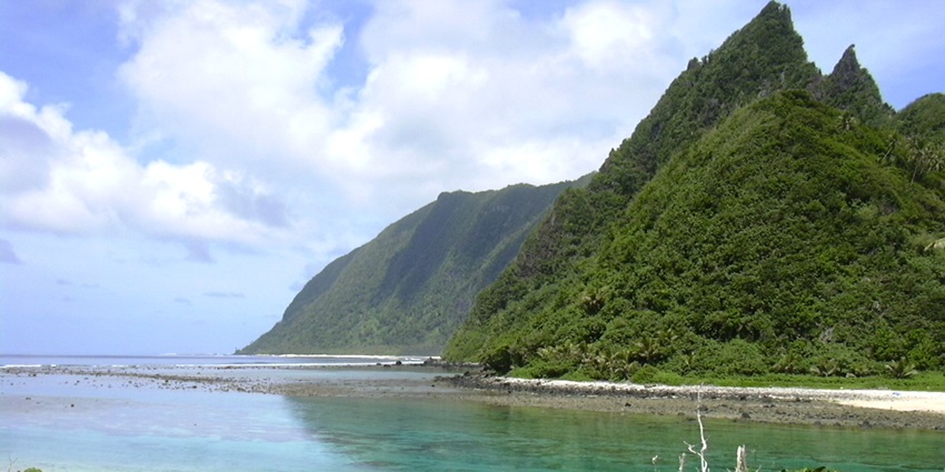 An image of the pristine Ofu Beach, with white sand and turquoise waters.