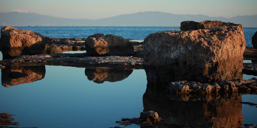 An image showing rock pools surrounded by rugged rocks in Old Gulch.