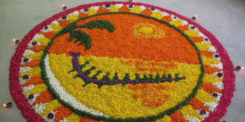 An image of the celebration of Onam festival, with a beautiful rangoli shown.