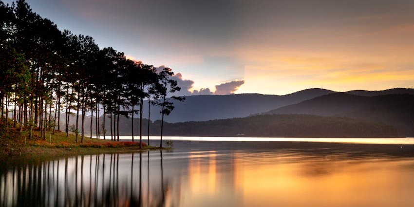 View of the Karad lake in Wayanad adorned by sunset hues