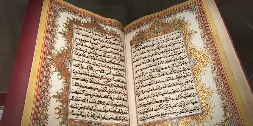 Central illumination of the religious text in the museum.