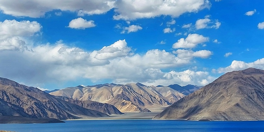 A scenic picture of the mountains surrounding the Pangong Lake