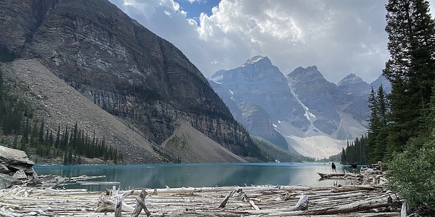 Scenic view of Moraine Lake with turquoise waters, surrounded by towering mountains