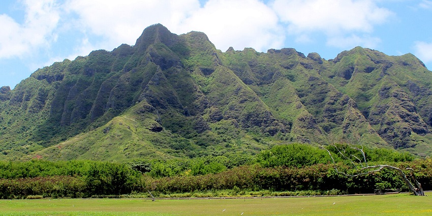 An image of the Northern hills of Oahu viewed from Kualoa Point, with scenic landscapes.