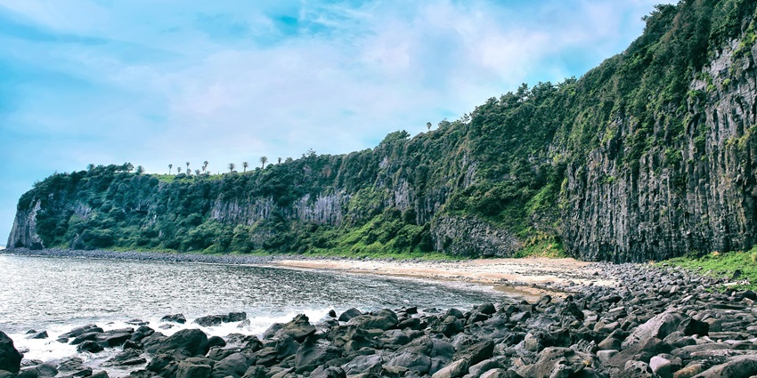 View of the rocky shores and cliffs of Chatham Islands, offering an ideal tropical escape