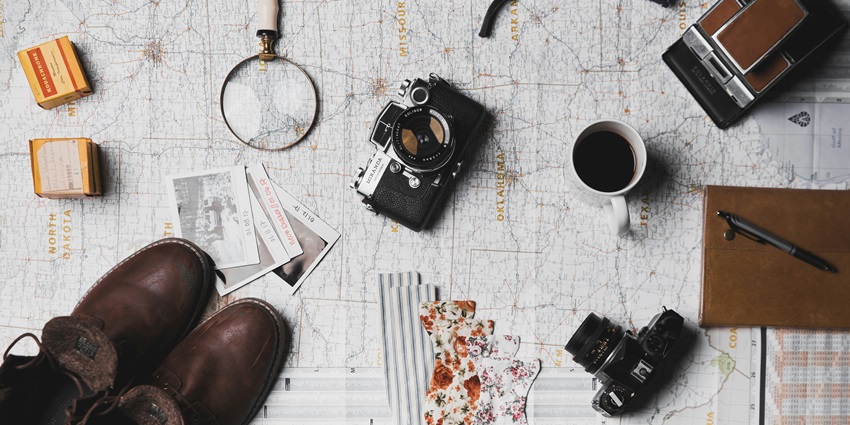 An image of travel items necessary for any trip for a seamless experience