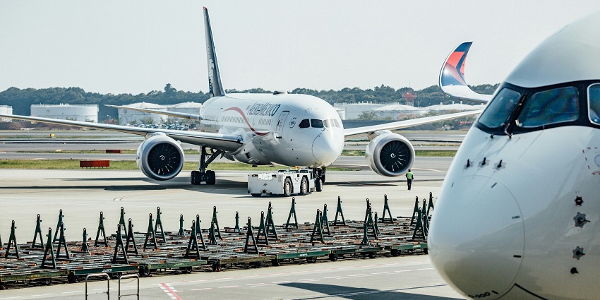 Image of an aeroplane in Rio di Janeiro during day time view and other airport facilities