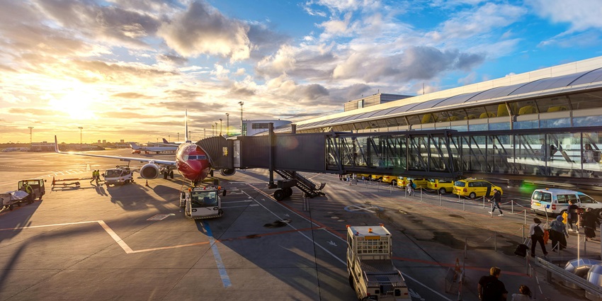 Image of the beautiful airport where a plane is docking on the taxi ran away