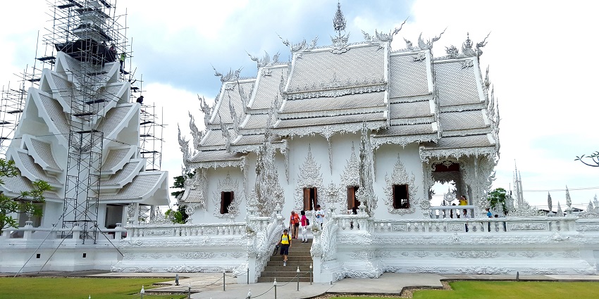 A Chiang Rai's temple with stunning architecture, intricate details.