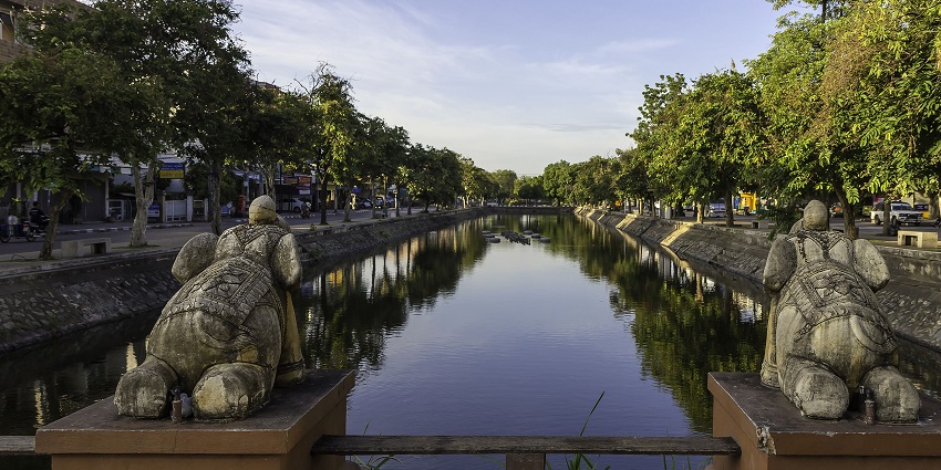 View of Chiang Mai moat, Thailand, lines with lush trees on both sides