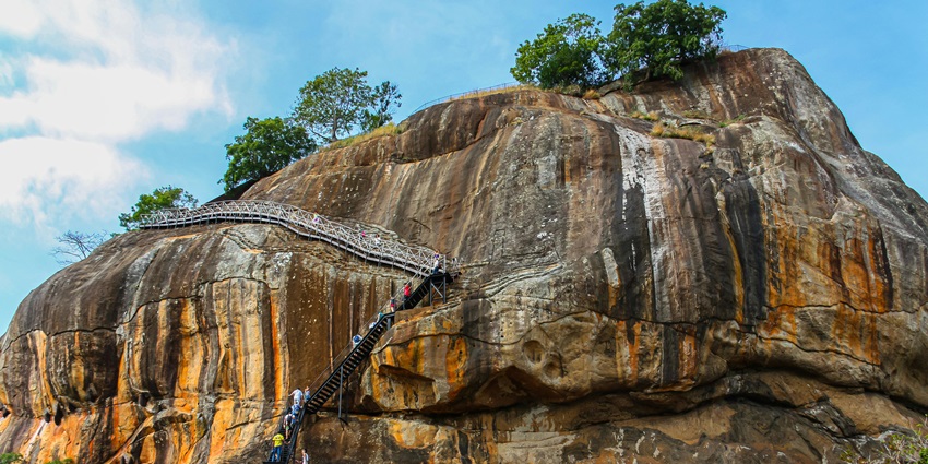 A group of travellers enjoying Dambulla with cultural sites and scenic landscapes.