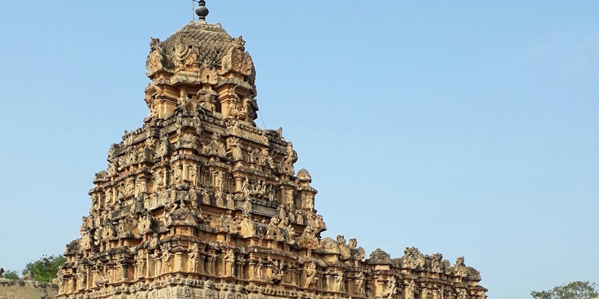 Beautiful facade of a Hindu temple featuring intricate carvings and stunning architecture.