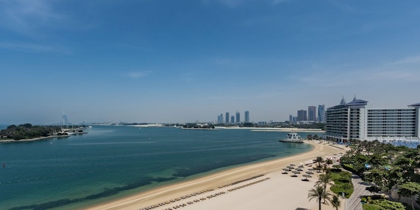 Burj Al Arab Beach features a sandy coast, lush greenery and crystal-clear water.