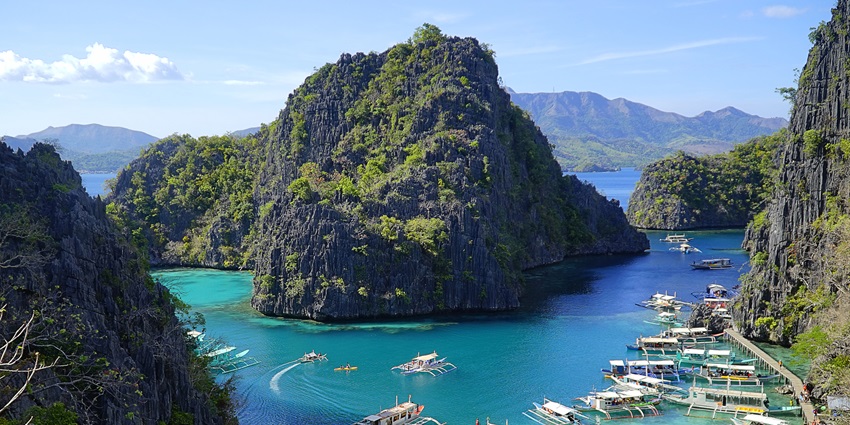 Explore stunning limestone cliffs, hidden lagoons, and vibrant marine life at Palawan.