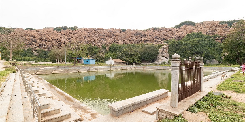Pampa Sarovar in Anegundi is a sacred lake with steps leading down to the water's edge.