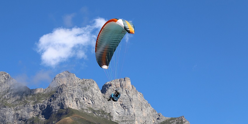 A paraglider in mid-air in Panchgani, Maharashtra - one of the spots for paragliding in India.