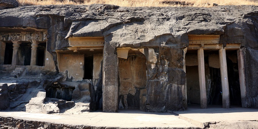 An image of ancient rock caves at Pandav Leni, a historical attraction near Malegaon Fort