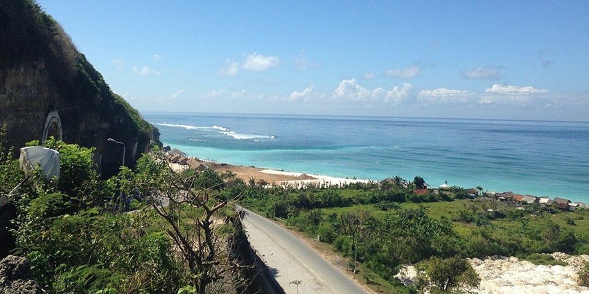 Marvel at the dramatic cliffs and crystal-clear waters at Pandawa Beach in Bali, Indonesia.