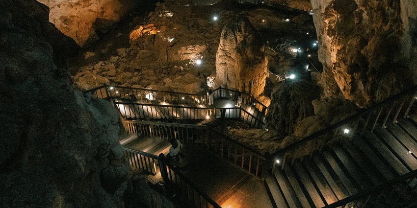 An image of Paradise Cave in Vietnam, showcasing its stunning stalactites, stalagmites, and vast chambers.