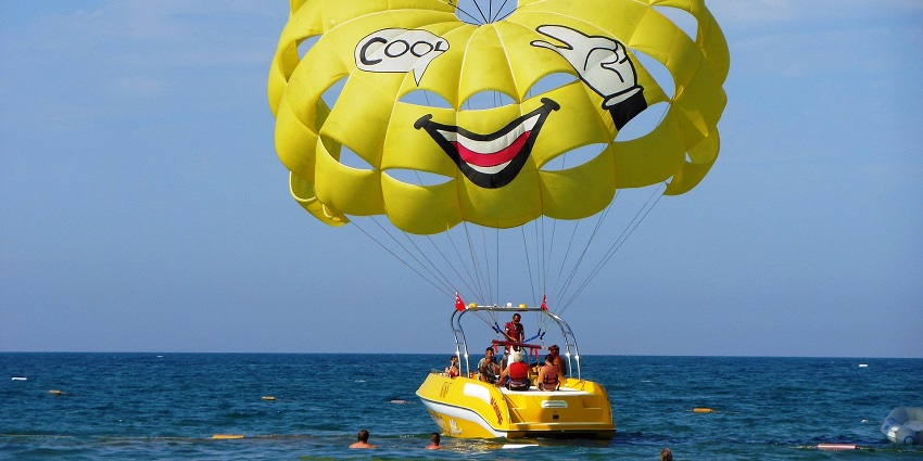 An image showing parasailing over the sea, a popular water sport at Calangute Beach