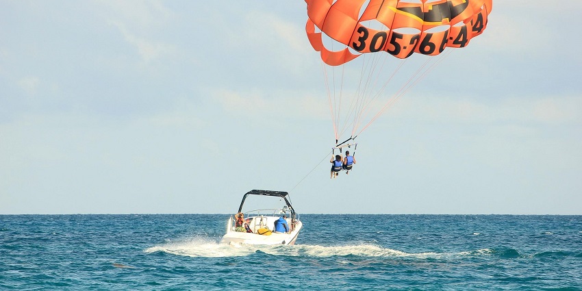 An image showing parasailing against a natural backdrop, highlighting an adventure activity.