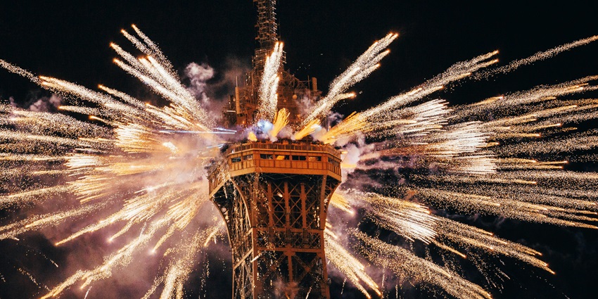A night-time view of Paris in France, one of the top places to celebrate New Year.