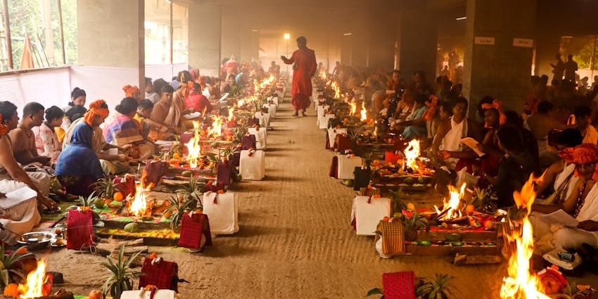 View of a group of pandits performing rituals at the temple