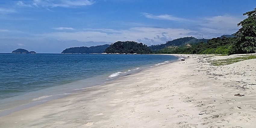 Enjoy the powdery white sand and turquoise waters of Pasir Panjang Beach