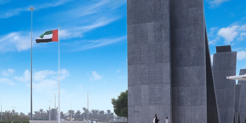 A scenic view of Wahat Al Karama memorial in Abu Dhabi, featuring symmetrical columns and a reflecting pool honouring UAE’s fallen heroes.