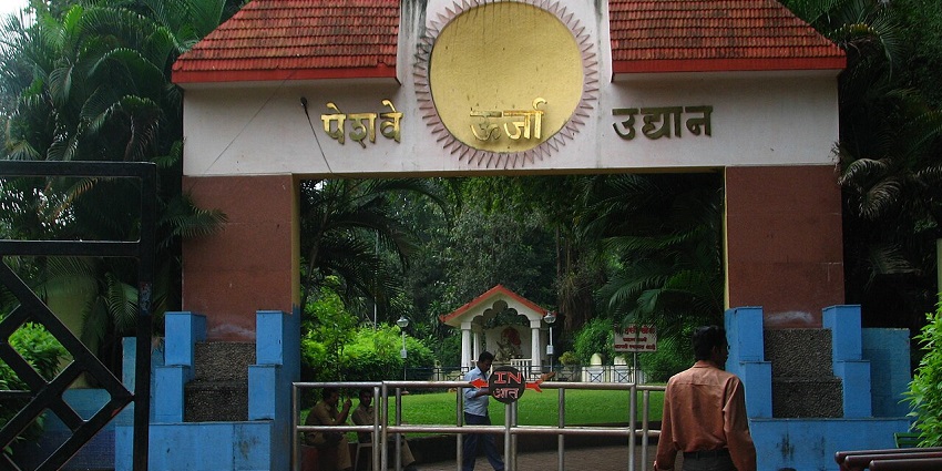 An image of an entrance to Peshwe Park, capturing its main gate and the charm of its surroundings.