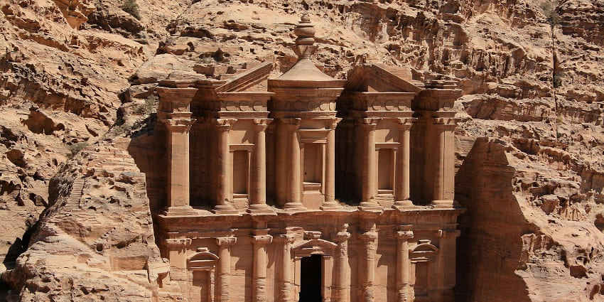 Stunning rock cut caves at Petra showcase ancient Nabatean artistry and deep secrets.