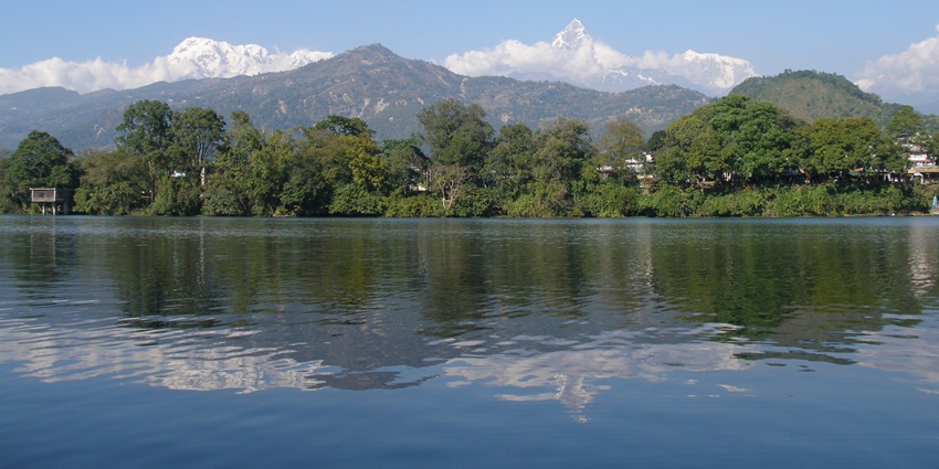 Phewa Lake, Nepal, a scenic gem, perfect for boating with stunning mountain reflections.