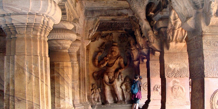 An image showing a cave with natural light filtering in, similar to Phnom Chhngok Cave Temple.