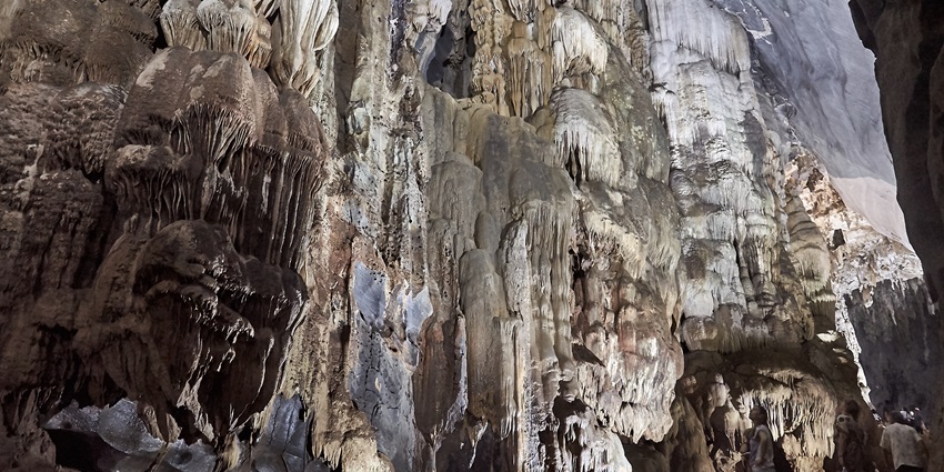 Mesmerising view of the rock formation in Phong Nha Cave dimly lit showcasing its beauty